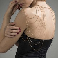 Magnifique · Cadena metálica hombros y espalda joyas oro